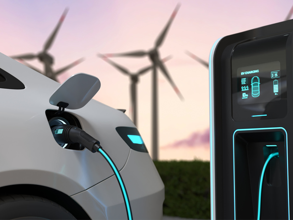 Electric car with person holding charging cable handle